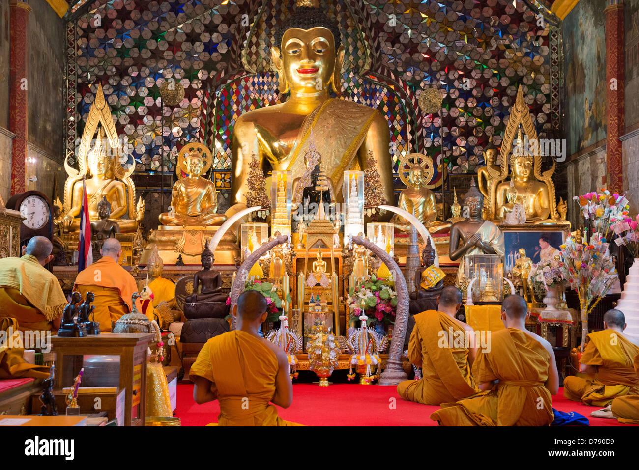 The monks prey inside main temple of Doi Sutep, Chiang Mai, Thailand Stock Photo