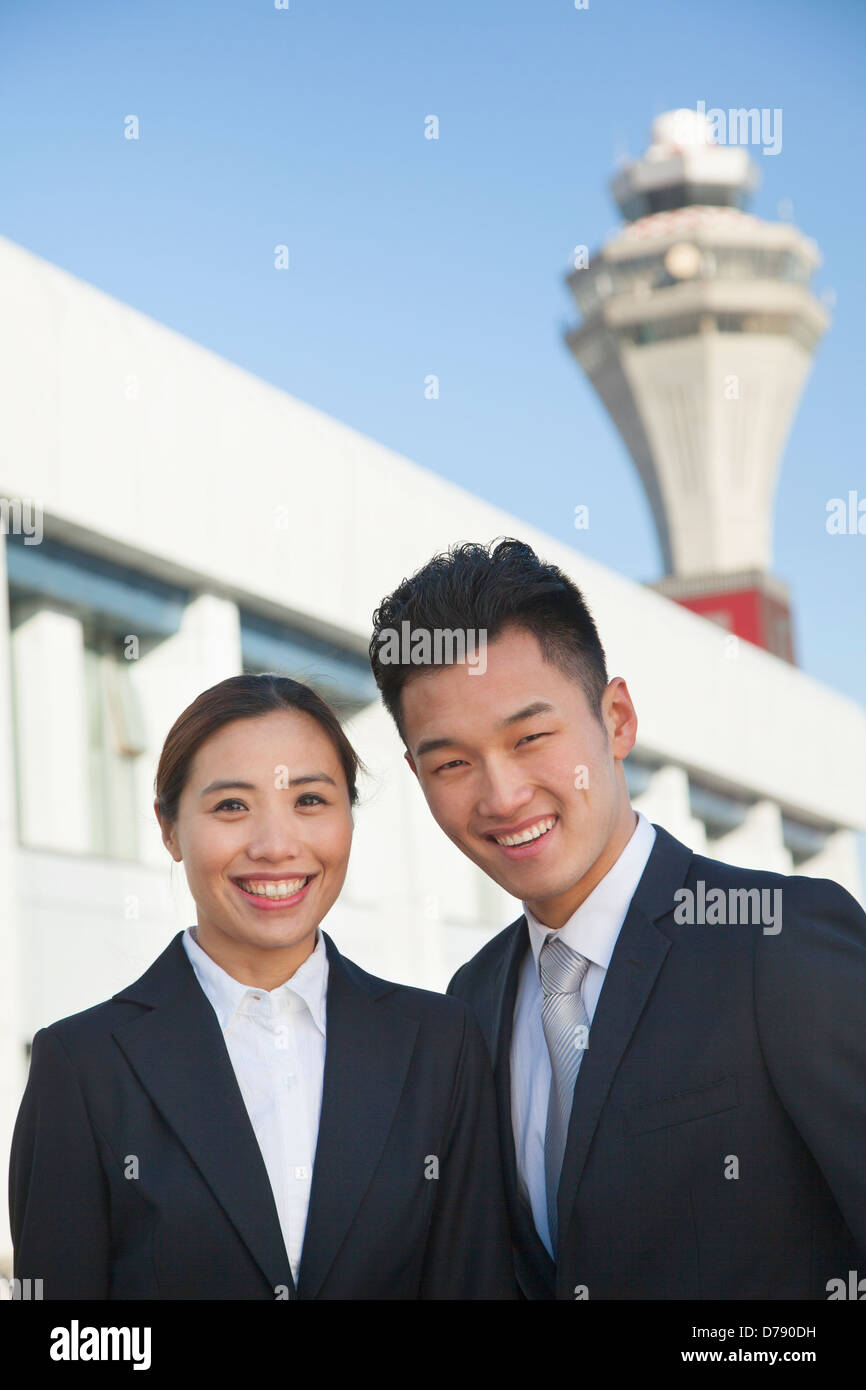 Two travelers portrait at airport Stock Photo Alamy
