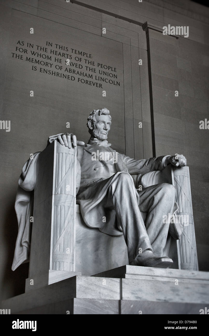 President Abraham Lincoln sits carved in marble below the quote about his fame Stock