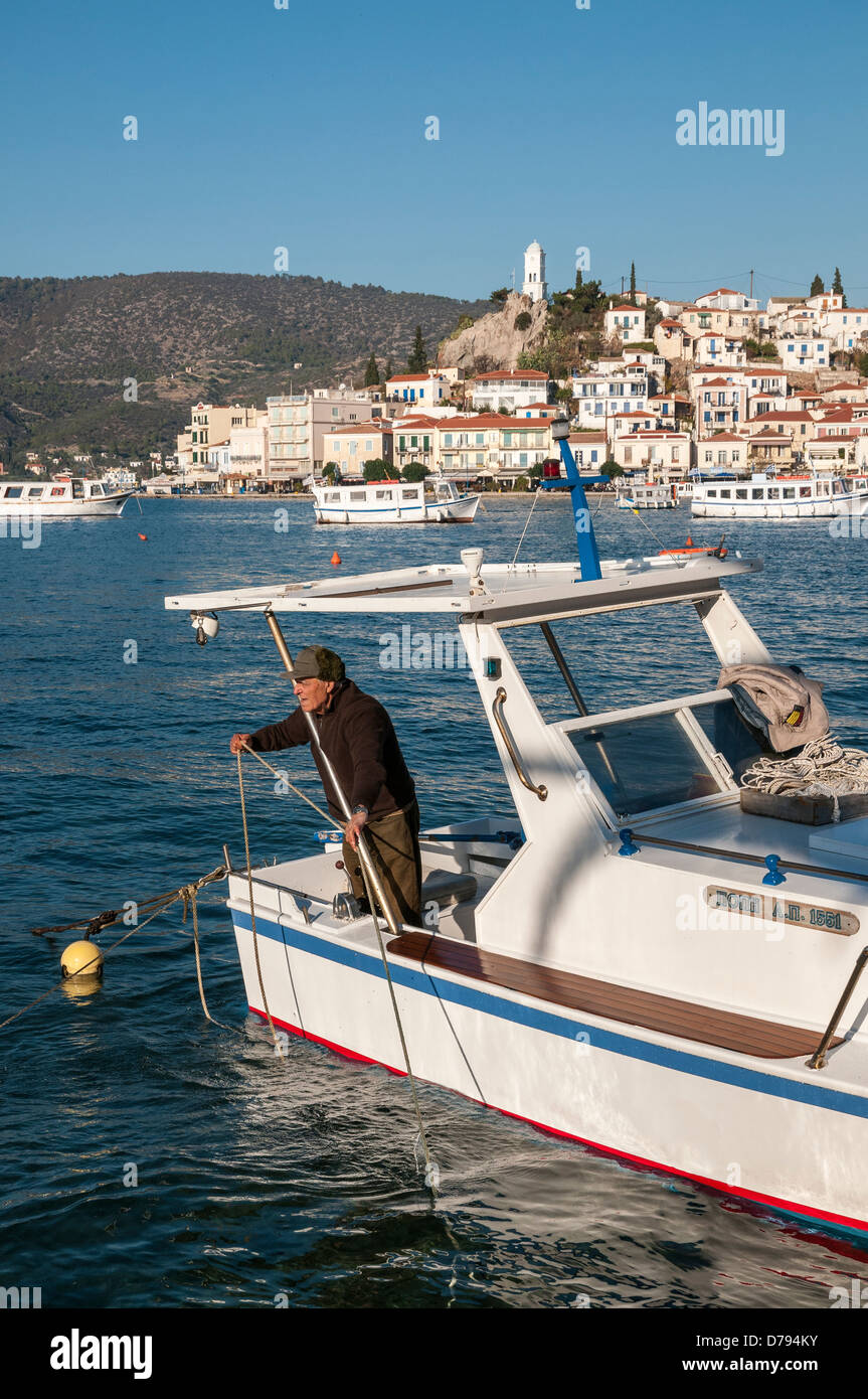 The Island and Town of Poros, seen from the harbour at Galatas, Attica, Peloponnese, Greece. Stock Photo