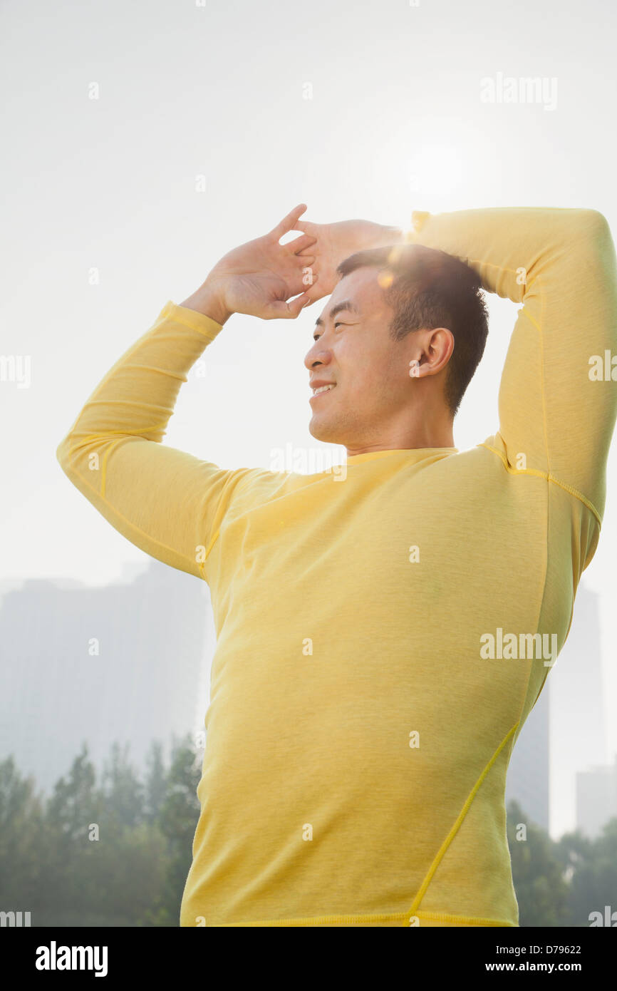 Young Muscular Man Stretching Stock Photo