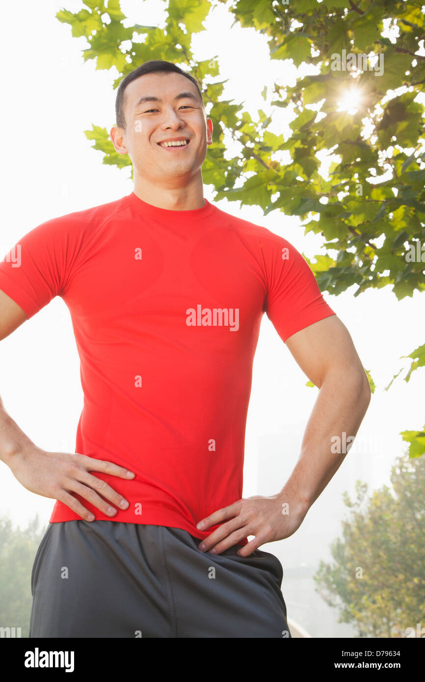 Young Muscular Man Standing and Smiling Stock Photo