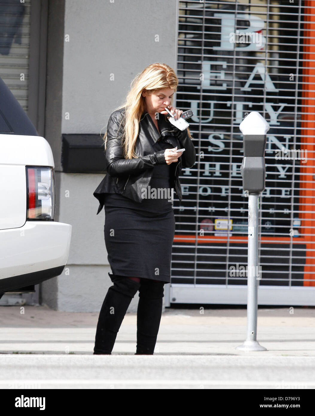 Kirstie Alley smoking a cigarette while out and about in Los Angeles