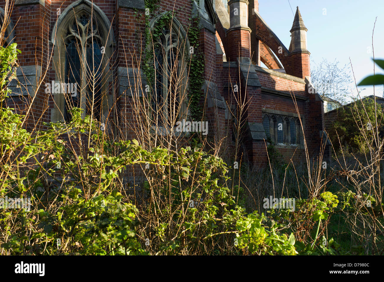 Church in overgrown churchyard,St Augustine's, Brighton Stock Photo
