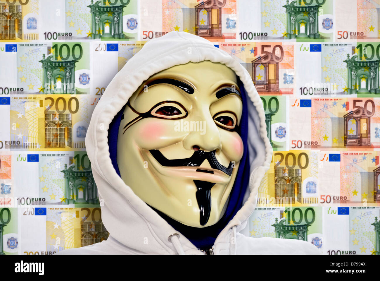 Man with Occupy mask before wall from bank notes, protests against the power of the banks , Mann mit Occupy-Maske vor Wand aus G Stock Photo