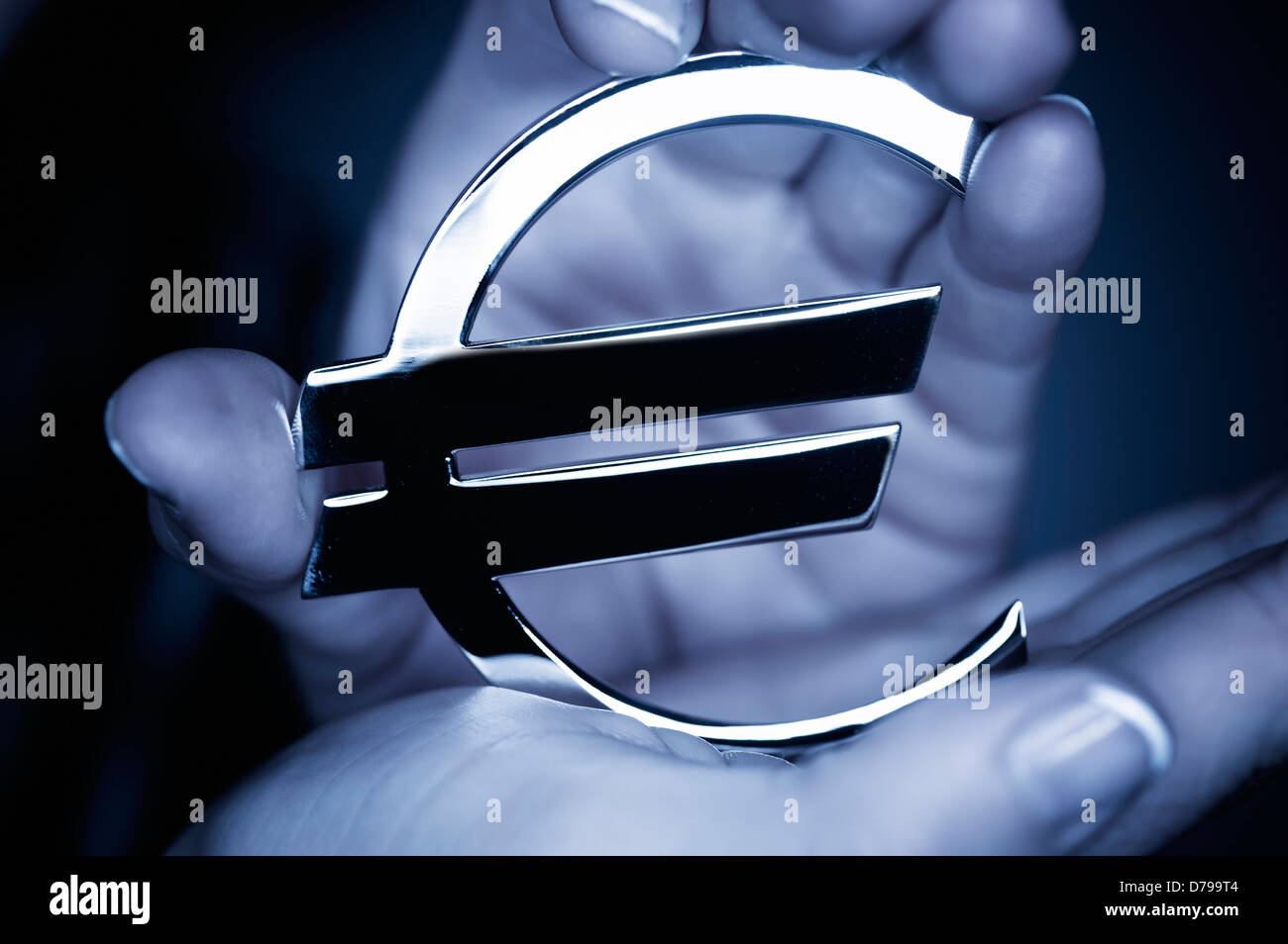 Woman holds eurosign, eurocrisis , Frau hält Eurozeichen, Eurokrise Stock Photo
