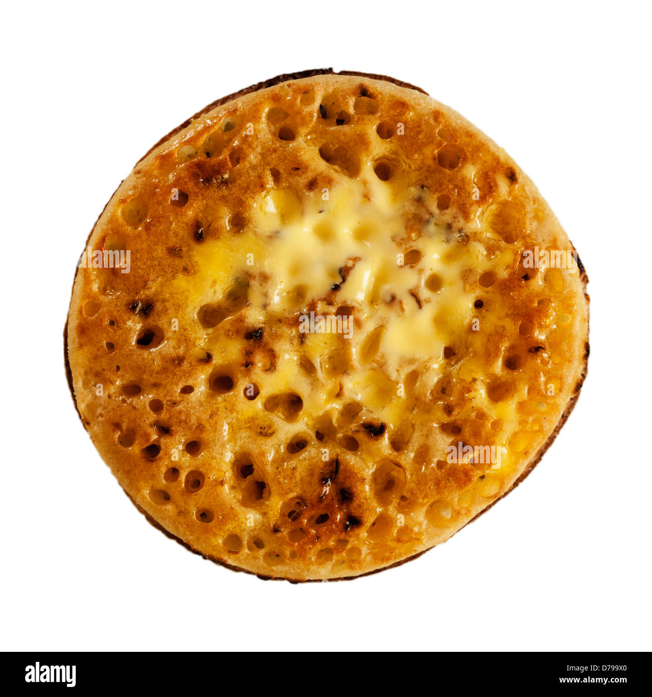 A buttered toasted crumpet on a white background Stock Photo