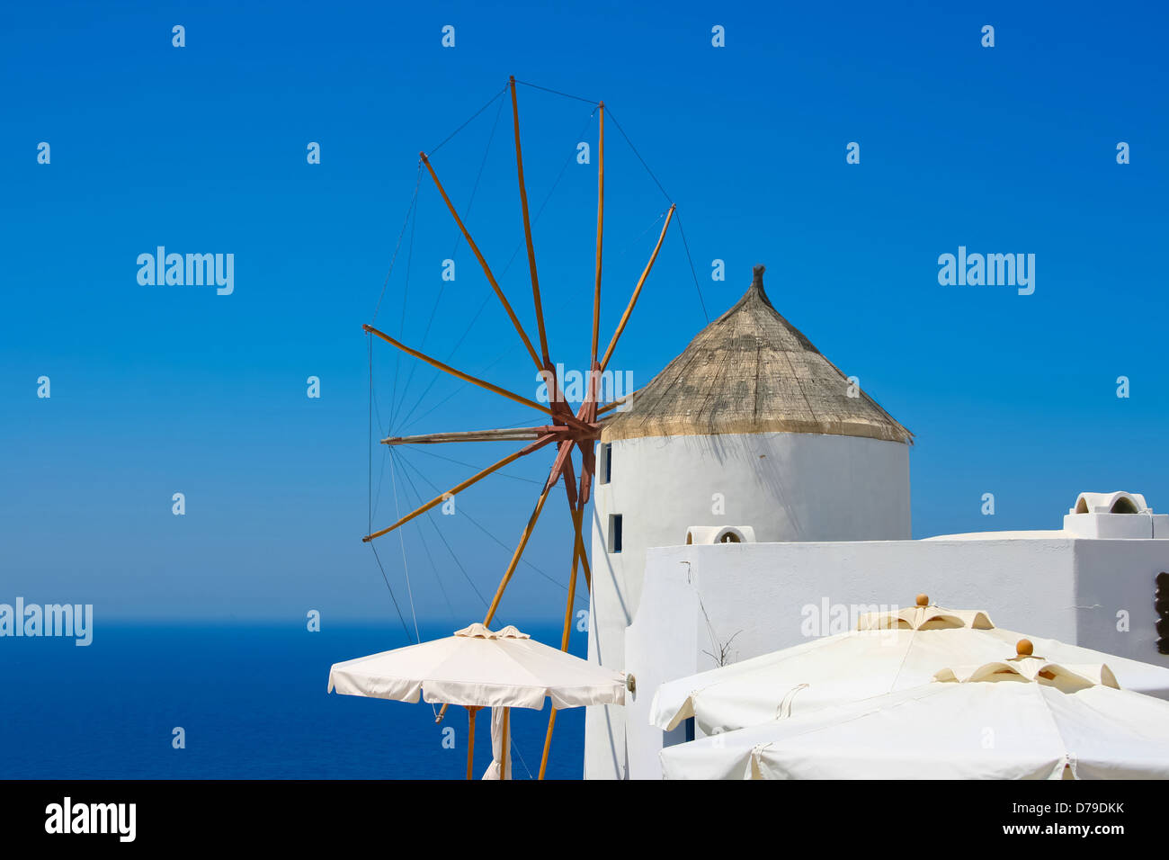 Windmill in Oia village on island of Santorini, Greece Stock Photo