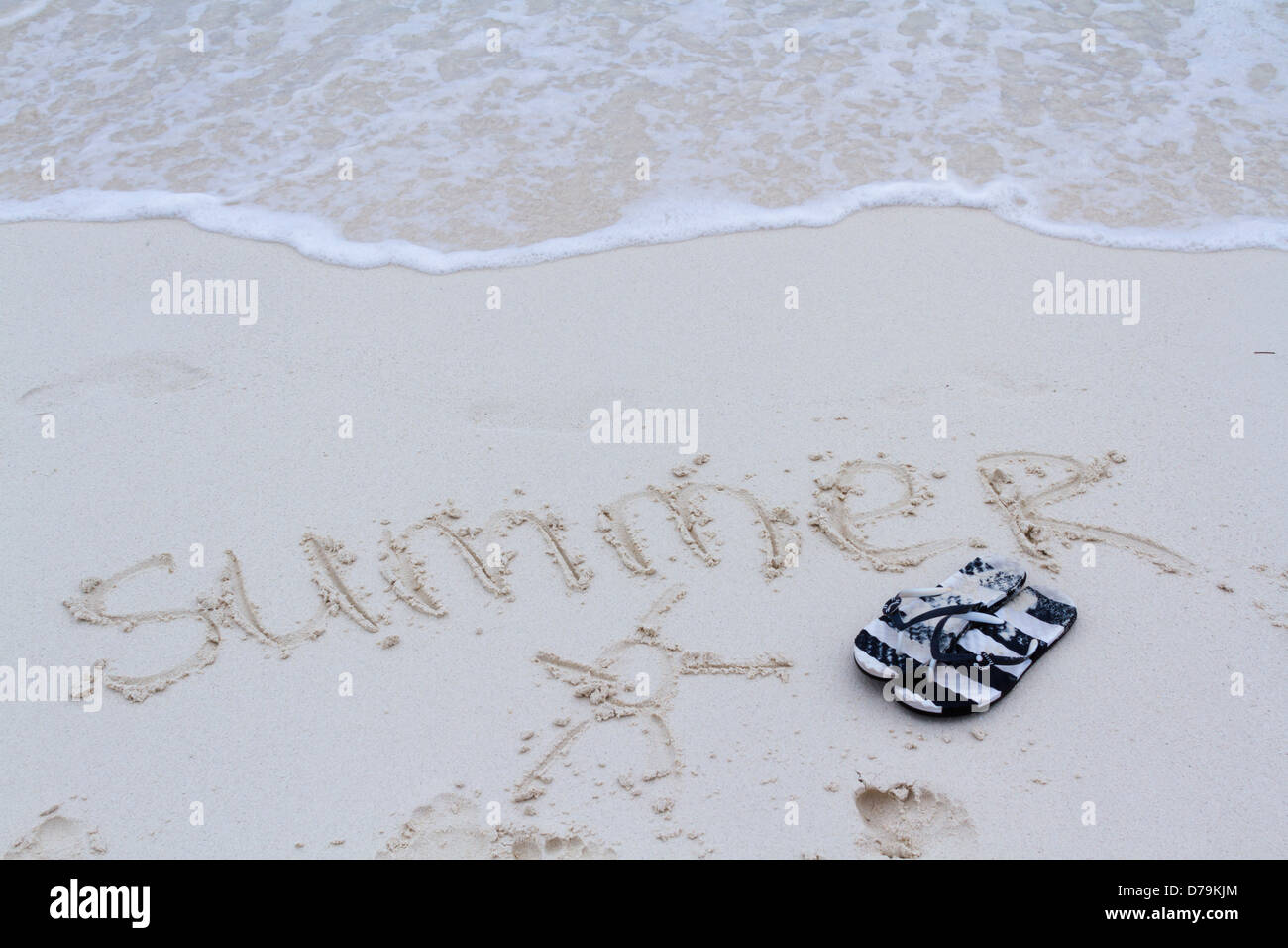Summer written on the beach with wave Stock Photo - Alamy