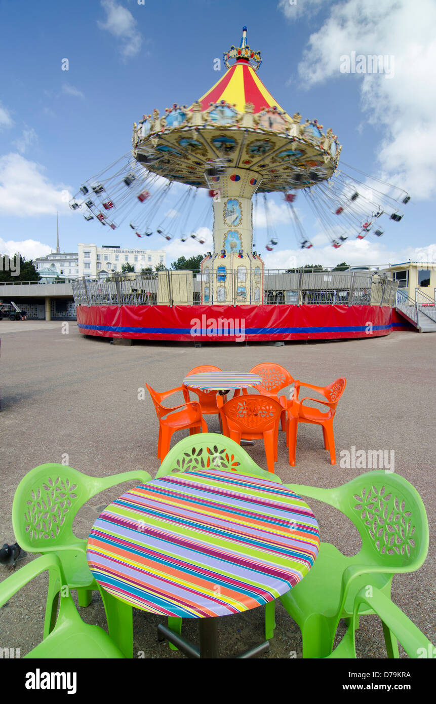 colourful merry-go-round and table with no people Stock Photo