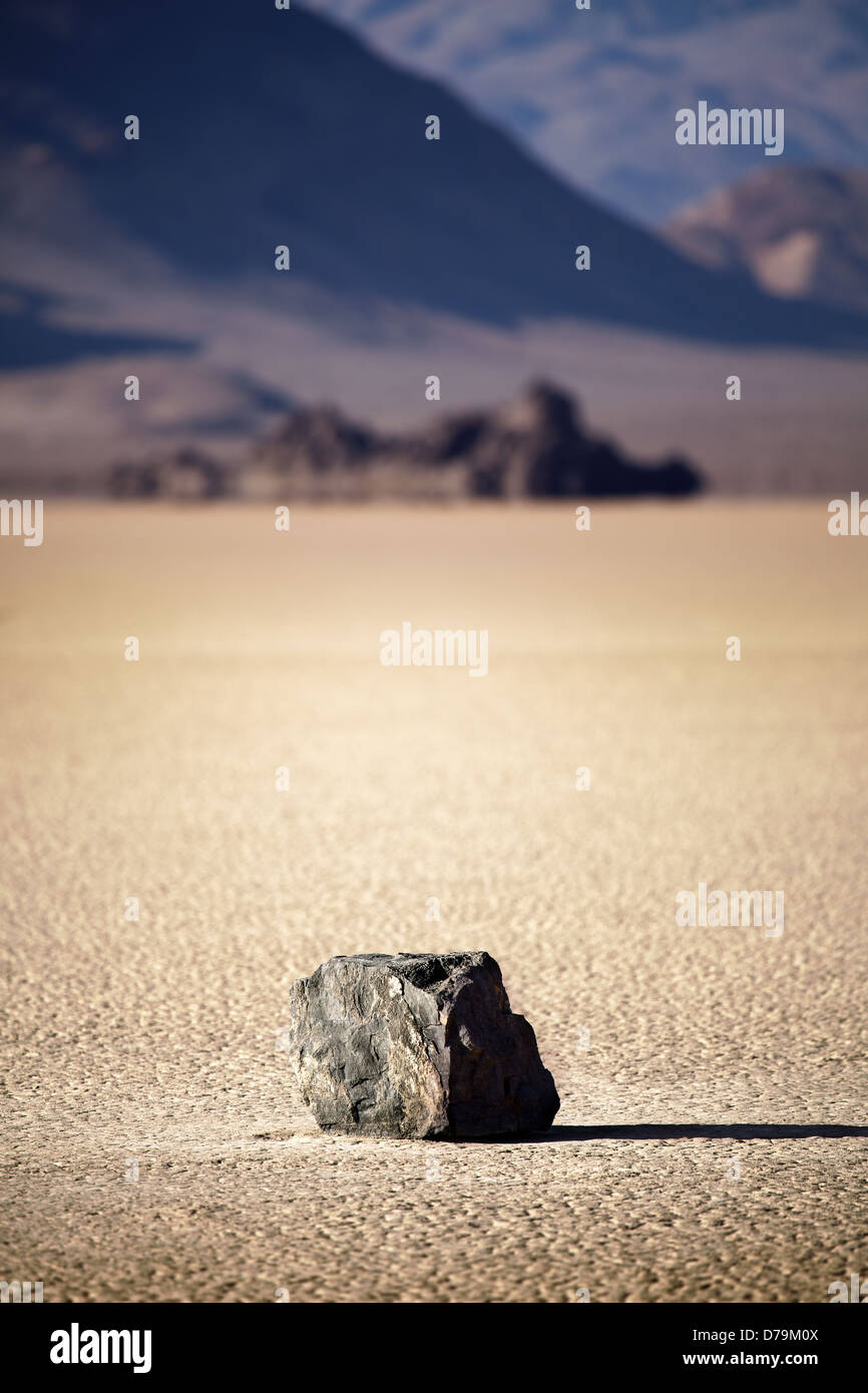 Death Valley National Park - lone rock in the middle of dry lake bed (Racetrack Playa) Stock Photo