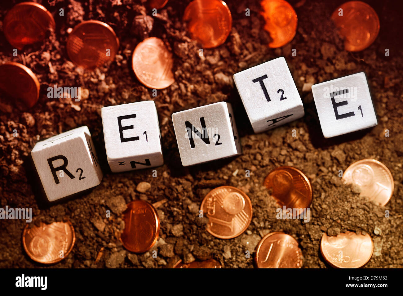 Pension stroke from cubes and cent coins, low pensions , Rente-Schriftzug aus Würfeln und Centmünzen, niedrige Renten Stock Photo