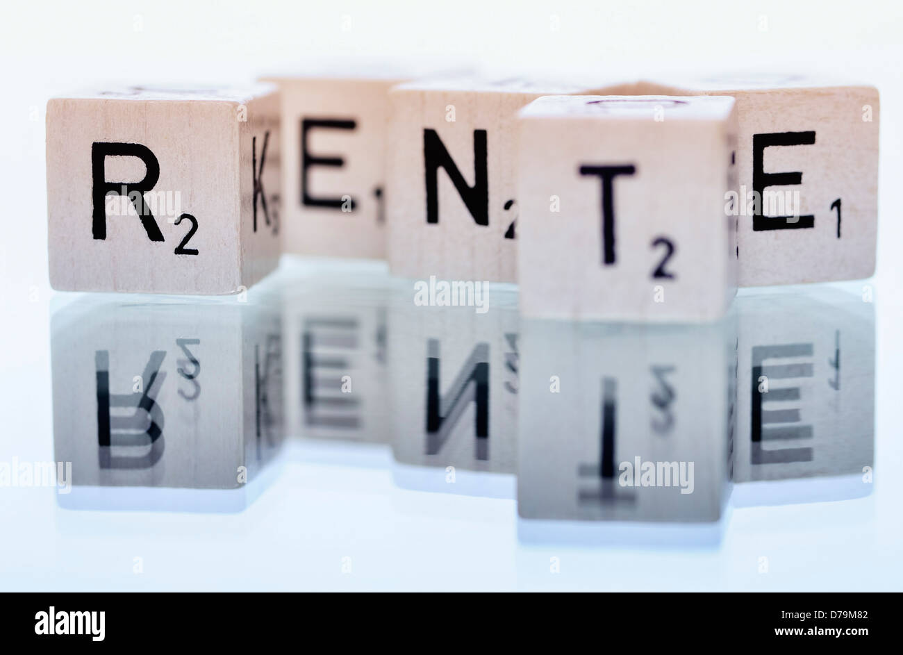 Cube letters with the word Pension , Würfelbuchstaben mit dem Wort Rente Stock Photo