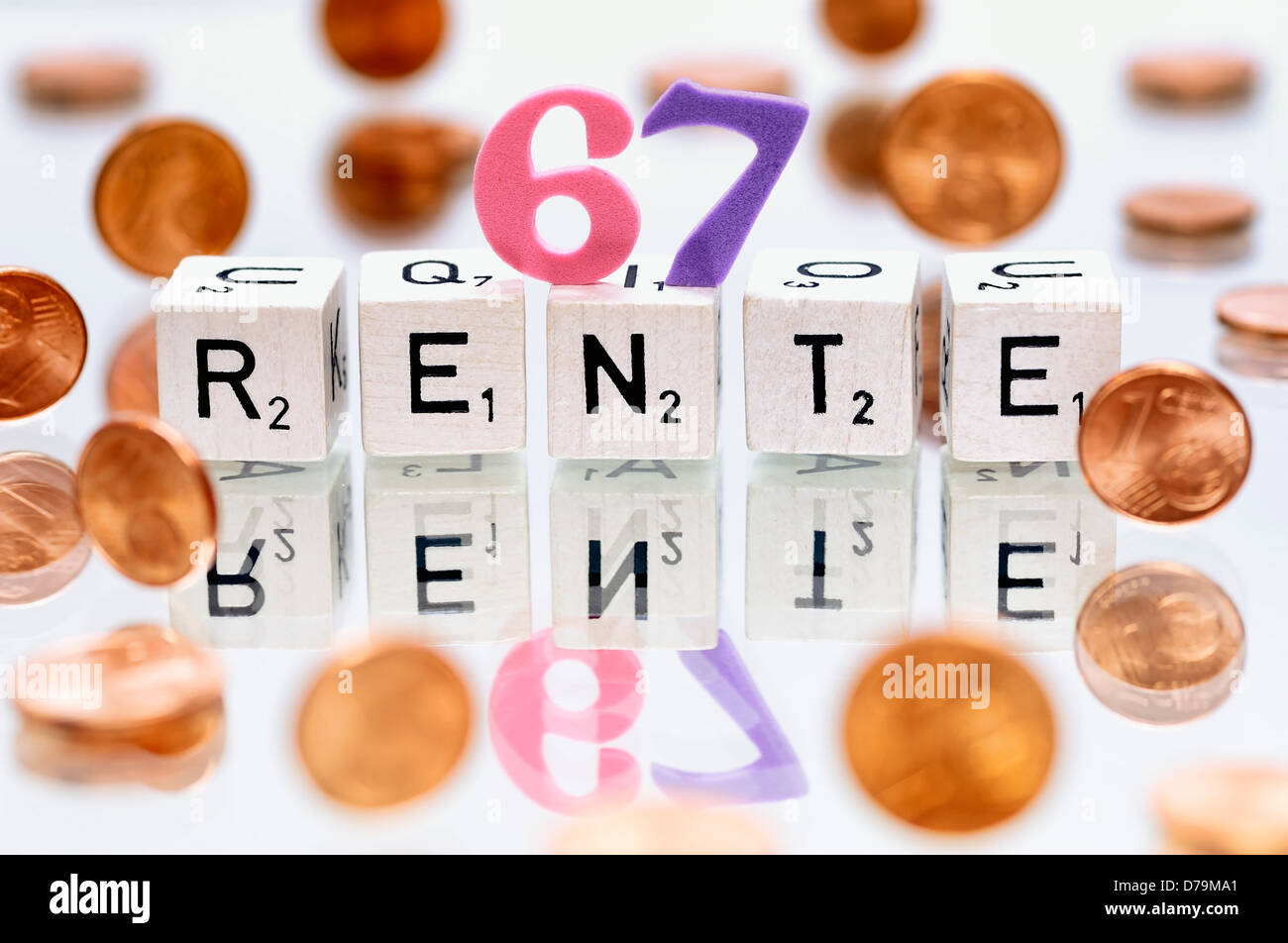 Cube letters with the word Pension, Pension beginning at the age of 67 years , Würfelbuchstaben mit dem Wort Rente, Rentenbeginn Stock Photo