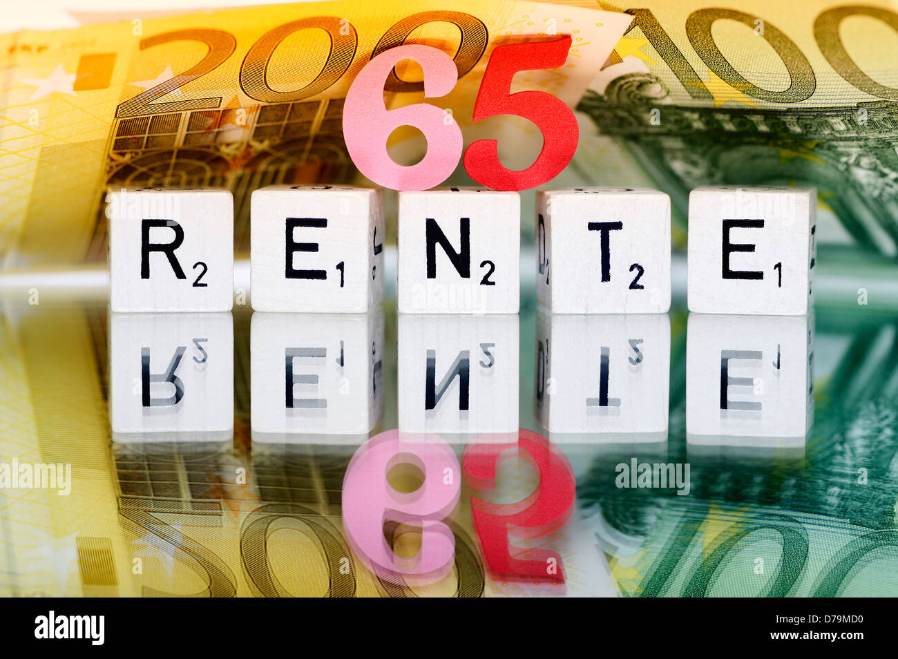 Cube letters with the word Pension, Pension beginning at the age of 65 years , Würfelbuchstaben mit dem Wort Rente, Rentenbeginn Stock Photo