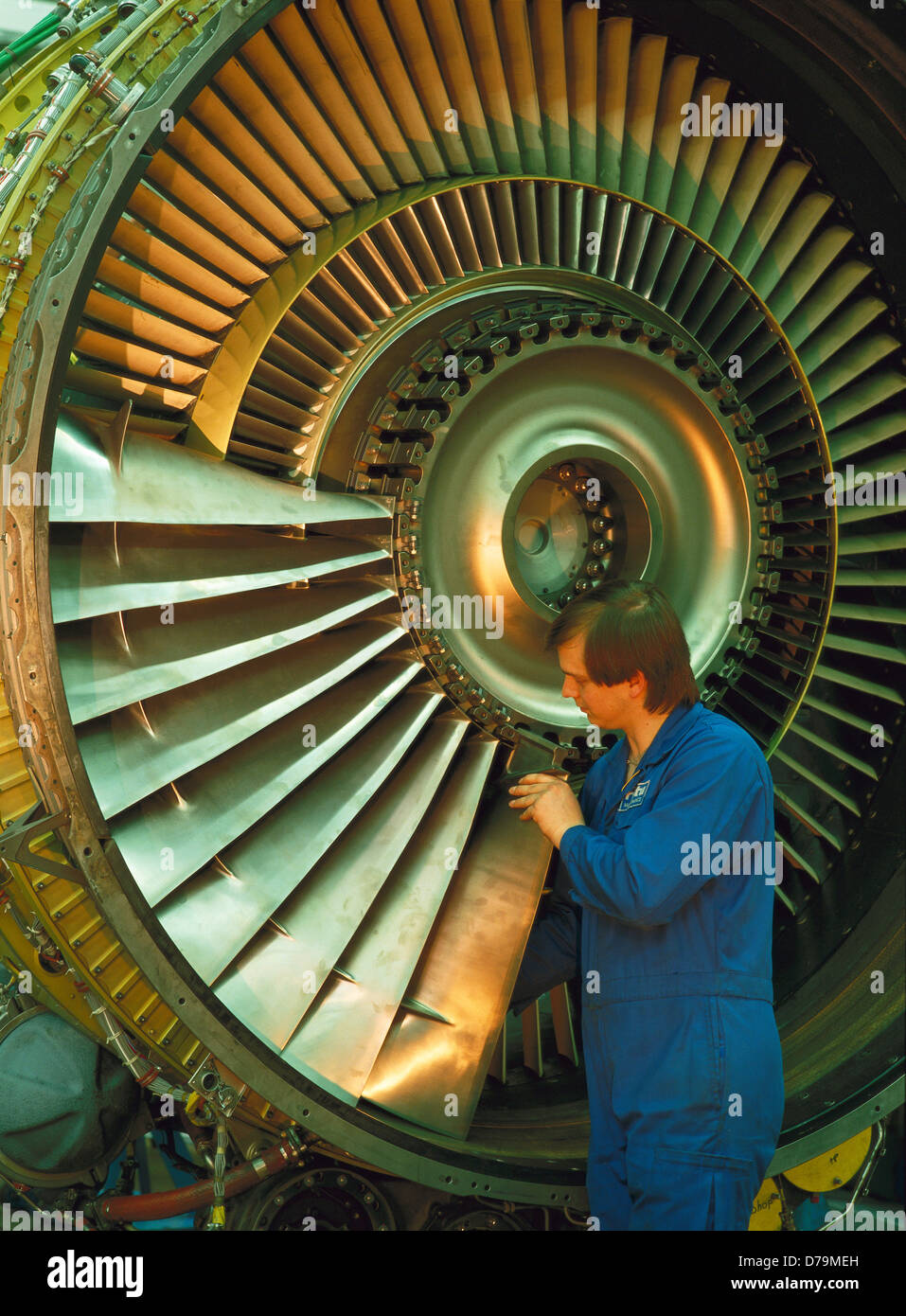 Aviation industry mechanic assembling fan blades power unit airplane