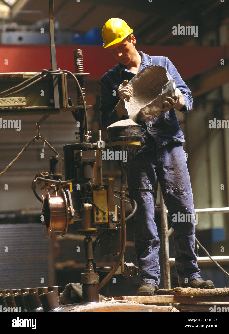 Mechanic setting up submergedarch welding machine Stock Photo Alamy