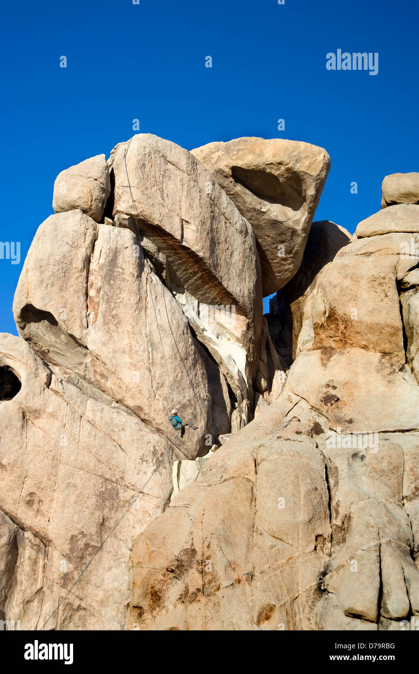 Rock climber at Joshua Tree National Monument in California Stock Photo