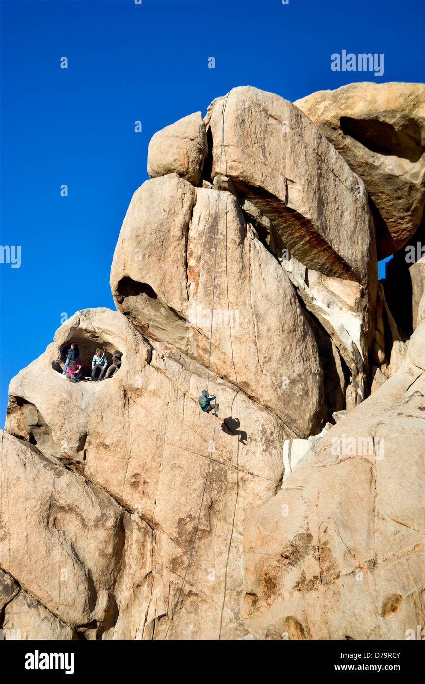 Rock climber at Joshua Tree National Monument in California Stock Photo