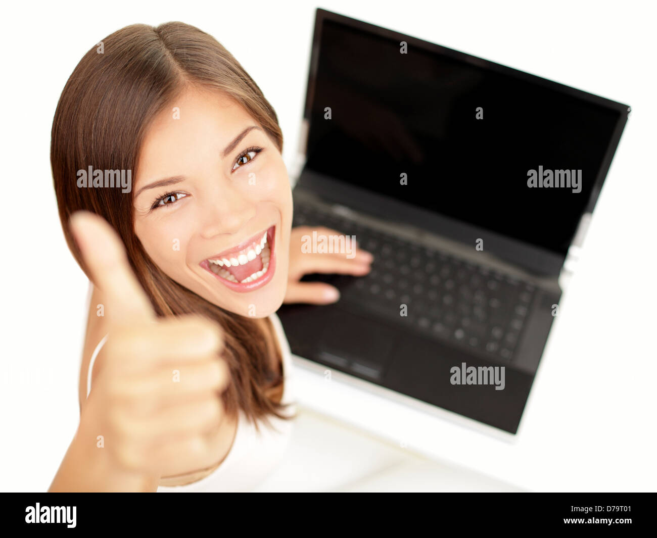 Laptop woman happy giving thumbs up success sign sitting at computer PC ...