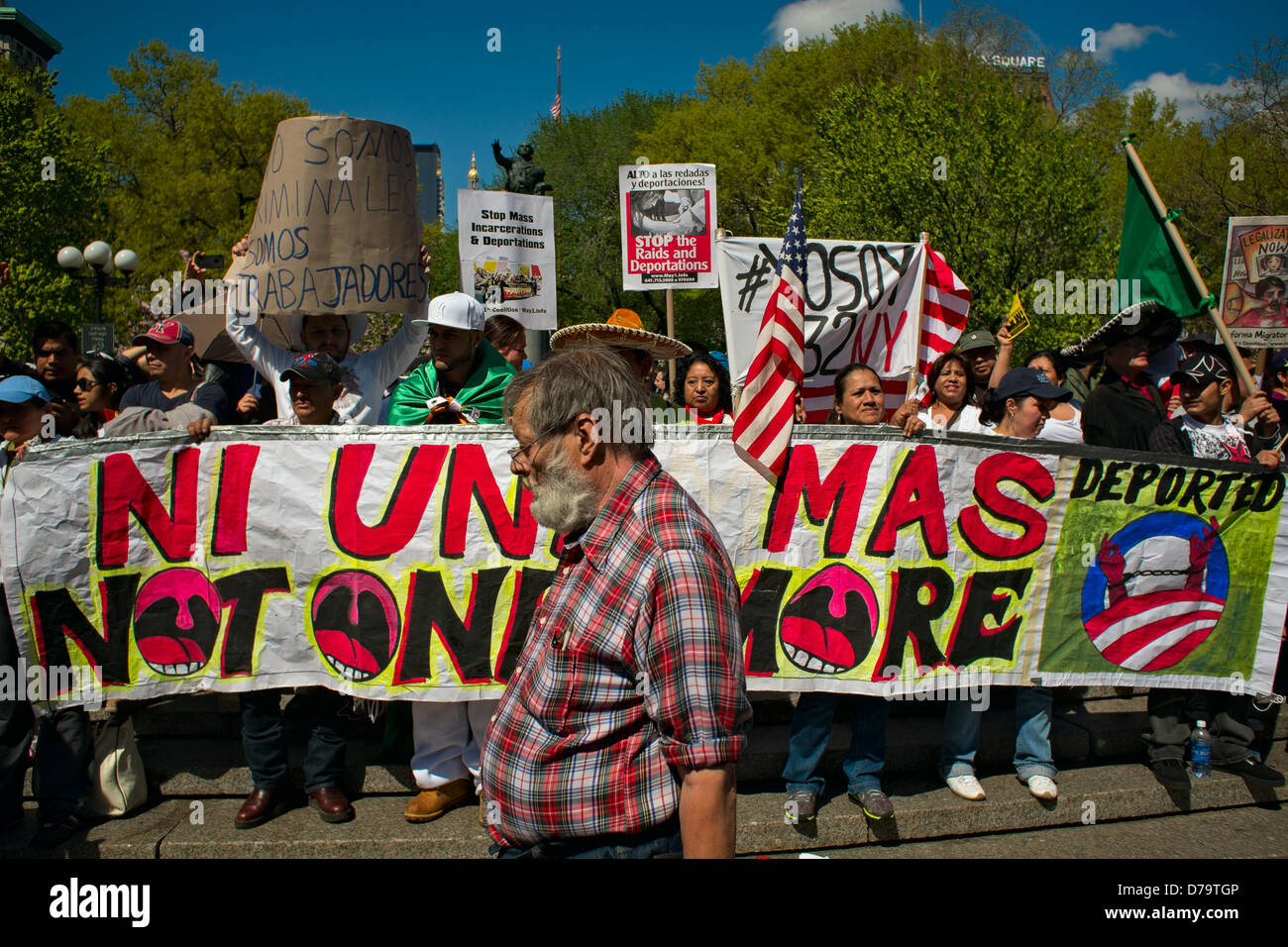 Wednesday, May 1, 2013, New York, NY, US:  Protesters gather in New York's Union Square to mark  International Workers' Day, also known as May Day.  These demonstrators held a sign reading 'Ni un mas' and 'Not one more' to protest United States immigration laws. Stock Photo