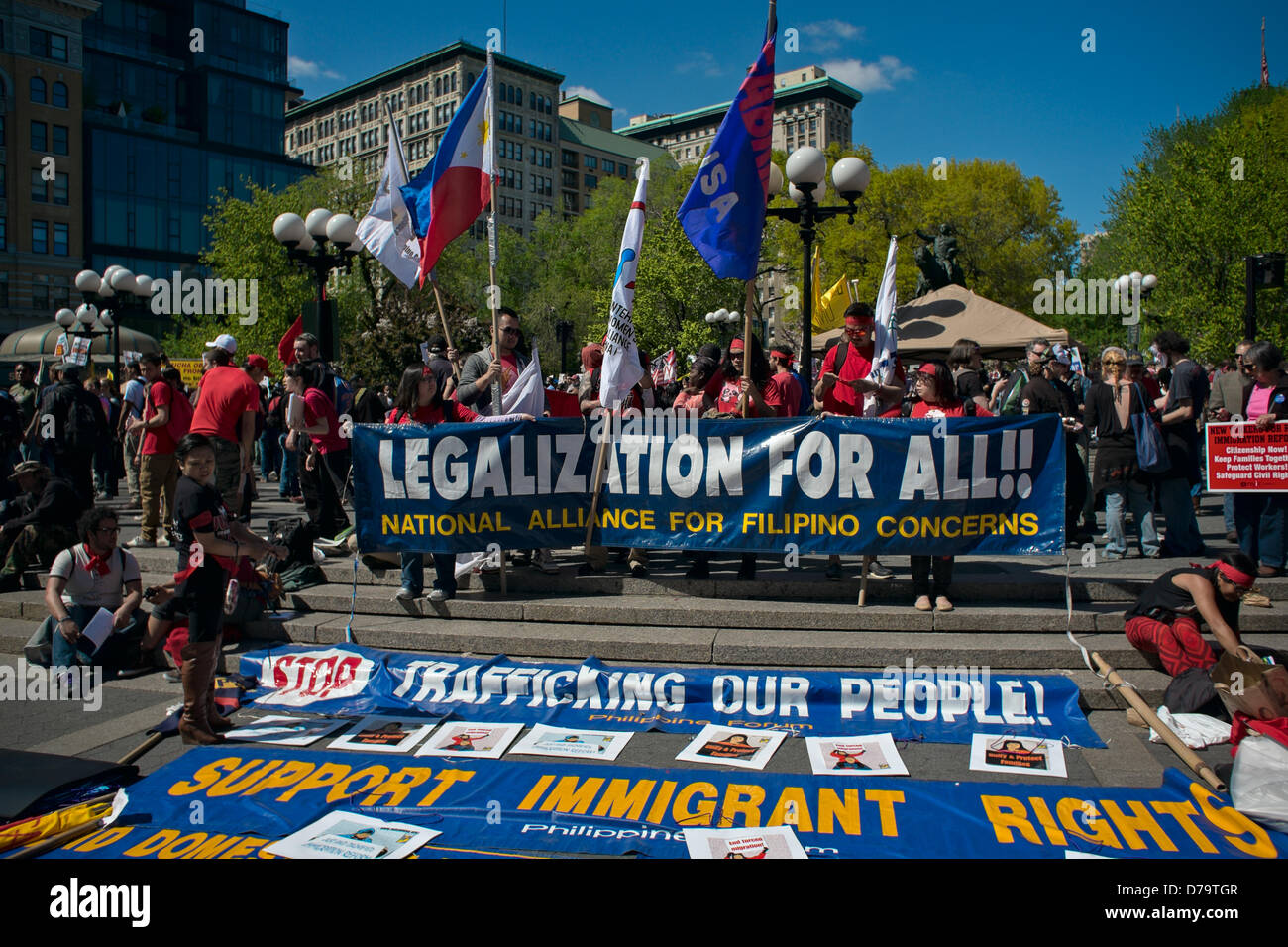Wednesday, May 1, 2013, New York, NY, US:  Protesters gather in New York's Union Square to mark  International Workers' Day, also known as May Day.  One group, the National Alliance for Filipino Concerns, held a sign calling for legalization of undocumented workers in the U.S. Stock Photo