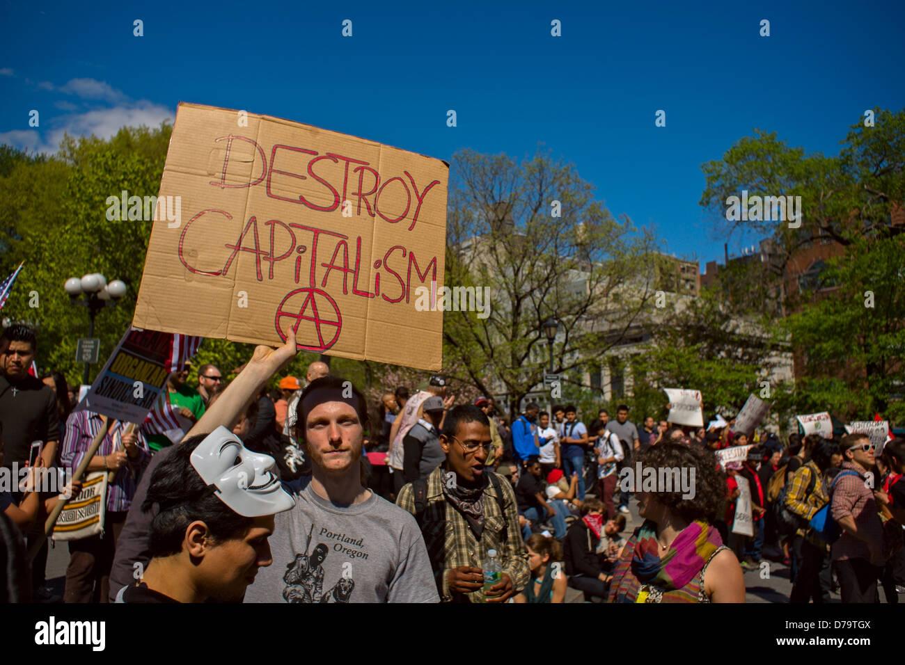 Wednesday, May 1, 2013, New York, NY, US:  A man holds a sign reading 'Destroy capitalism' as protesters gather in New York's Union Square to mark  International Workers' Day, also known as May Day. Stock Photo