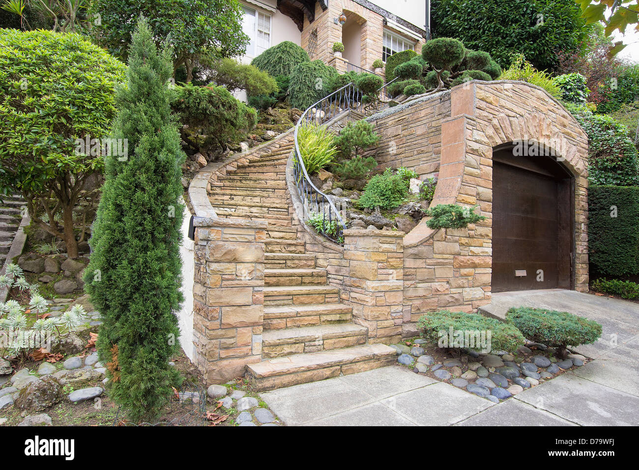 Stone Veneer Faccade on Home Exterior with Manicured Front Entrance Yard Landscape Stock Photo