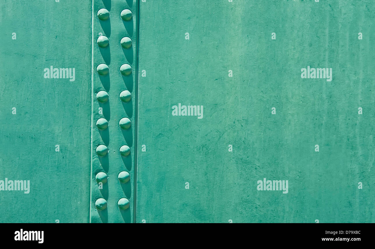 Copper green steel door with a riveted seam. Use as a designer