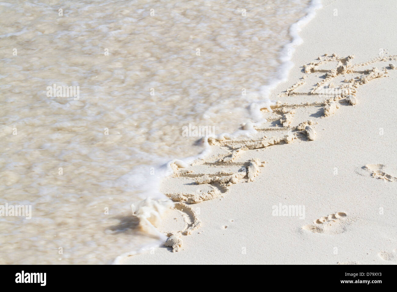 Summer written on the beach with wave Stock Photo - Alamy