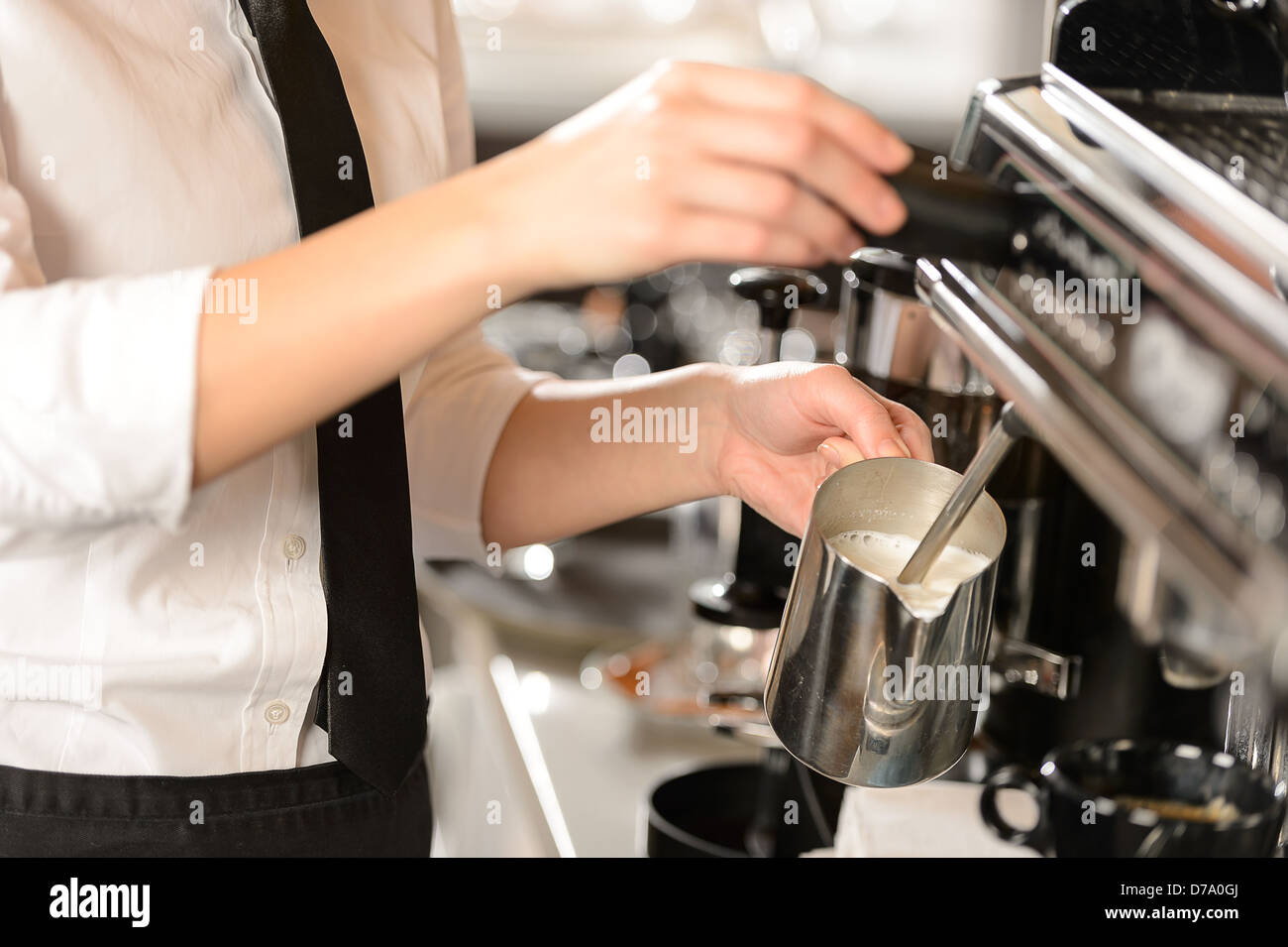 Barista steaming milk for hot cappuccino with machine Stock Photo Alamy