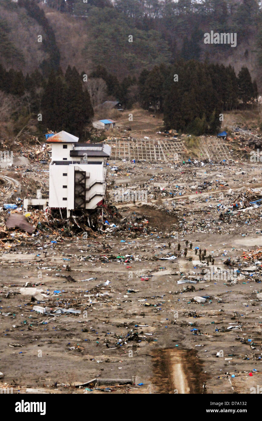 Search Rescue Team Searches Through Rubble in Wakuya Japan Stock Photo