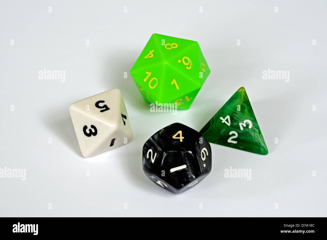 Platonic dice selection against a white background. Stock Photo