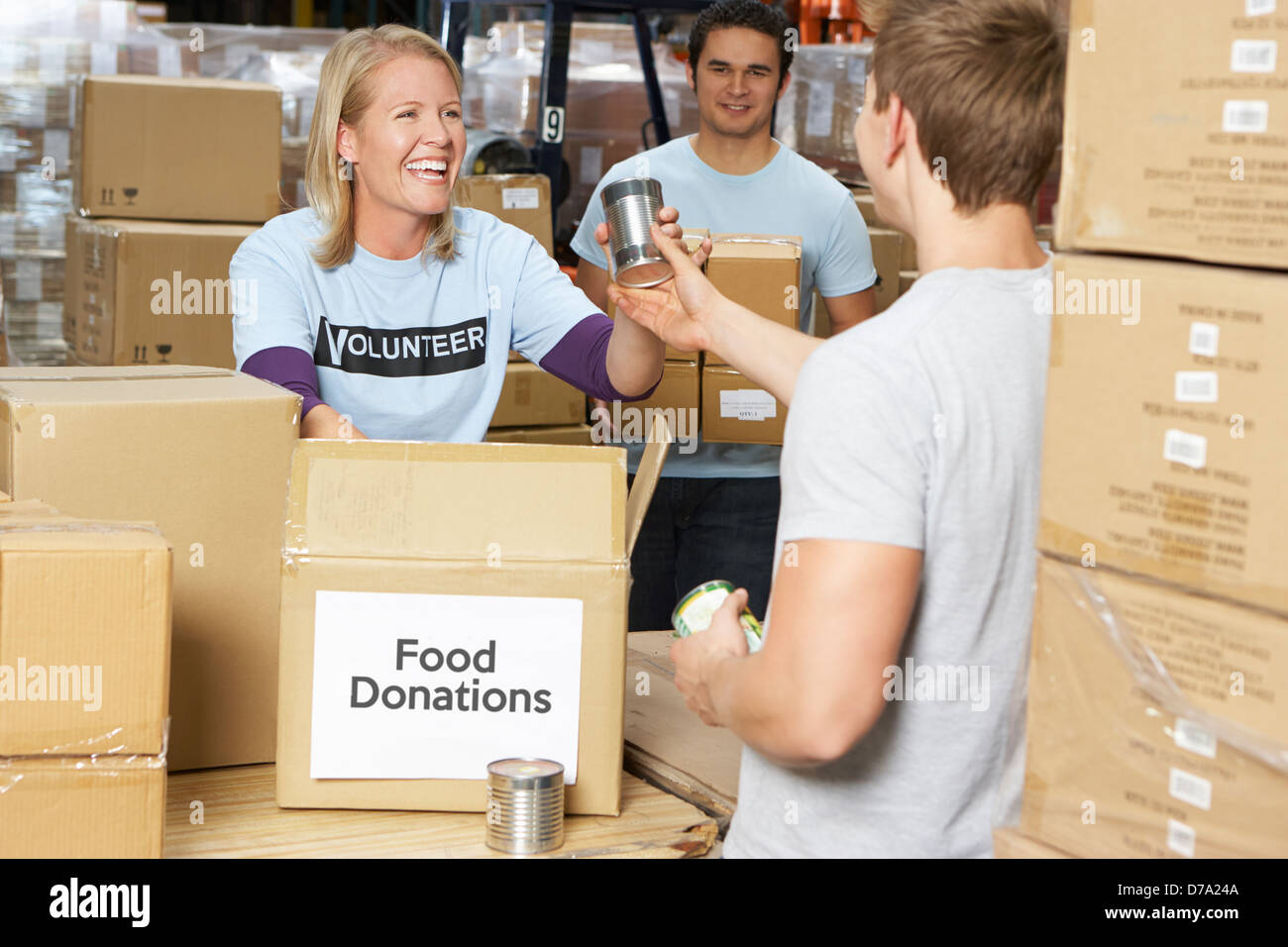 Volunteers Collecting Food Donations In Warehouse Stock Photo Alamy