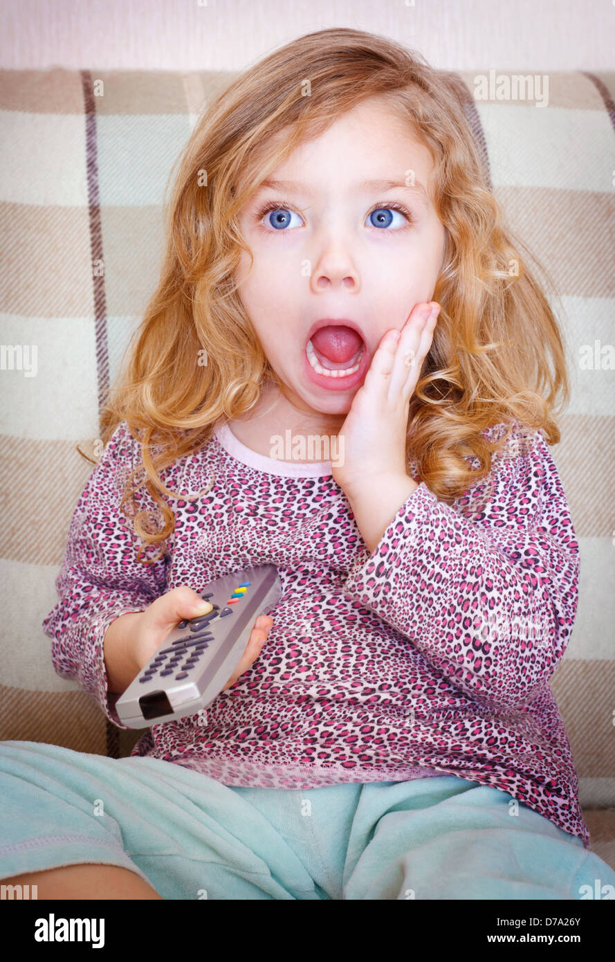 Little girl watching TV Stock Photo