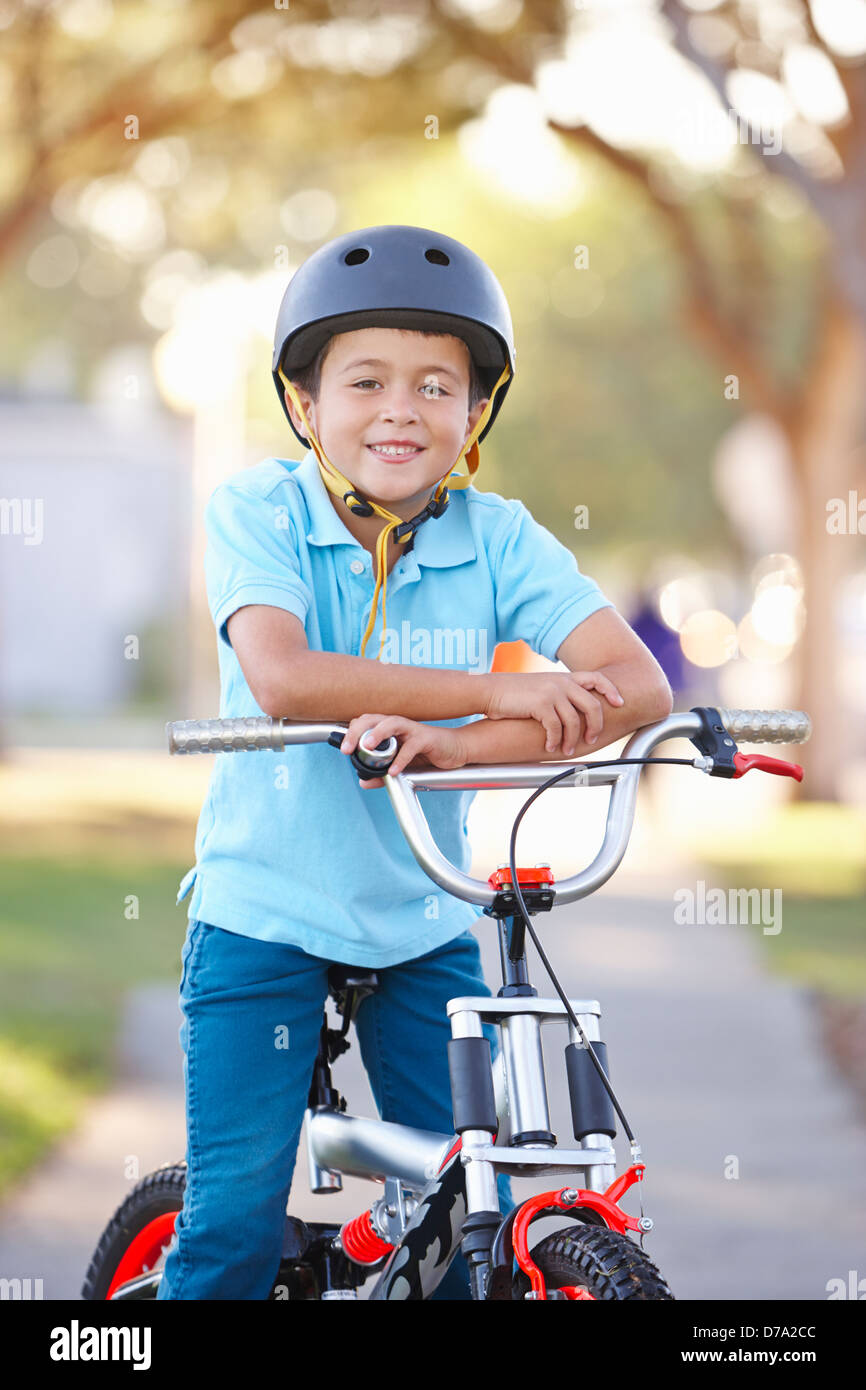 Boy Wearing Safety Helmet Riding Bike Stock Photo Alamy