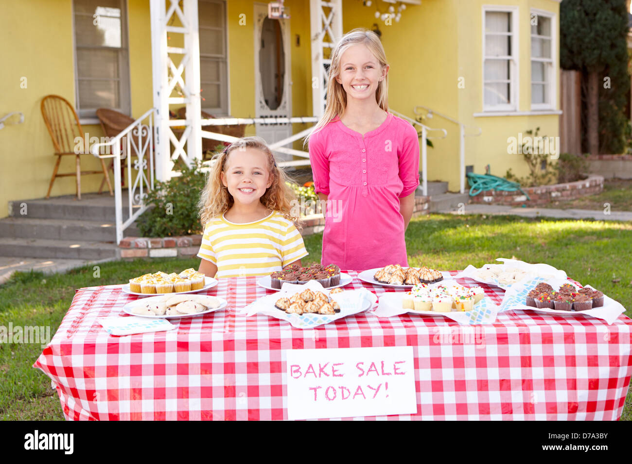 Children Running Charity Bake Sale Stock Photo