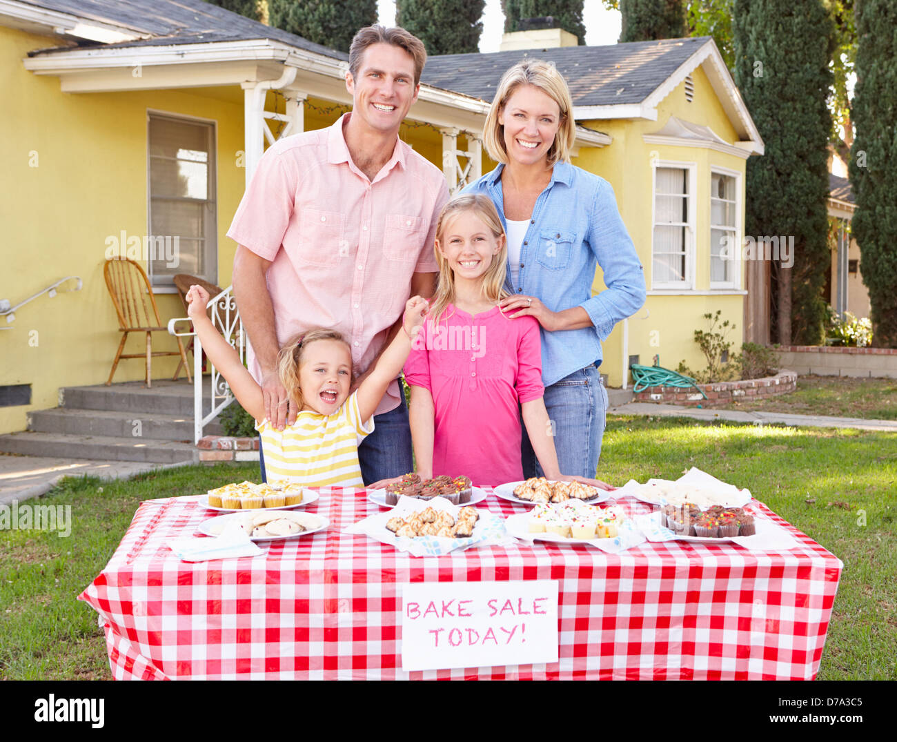 Family Running Charity Bake Sale Stock Photo