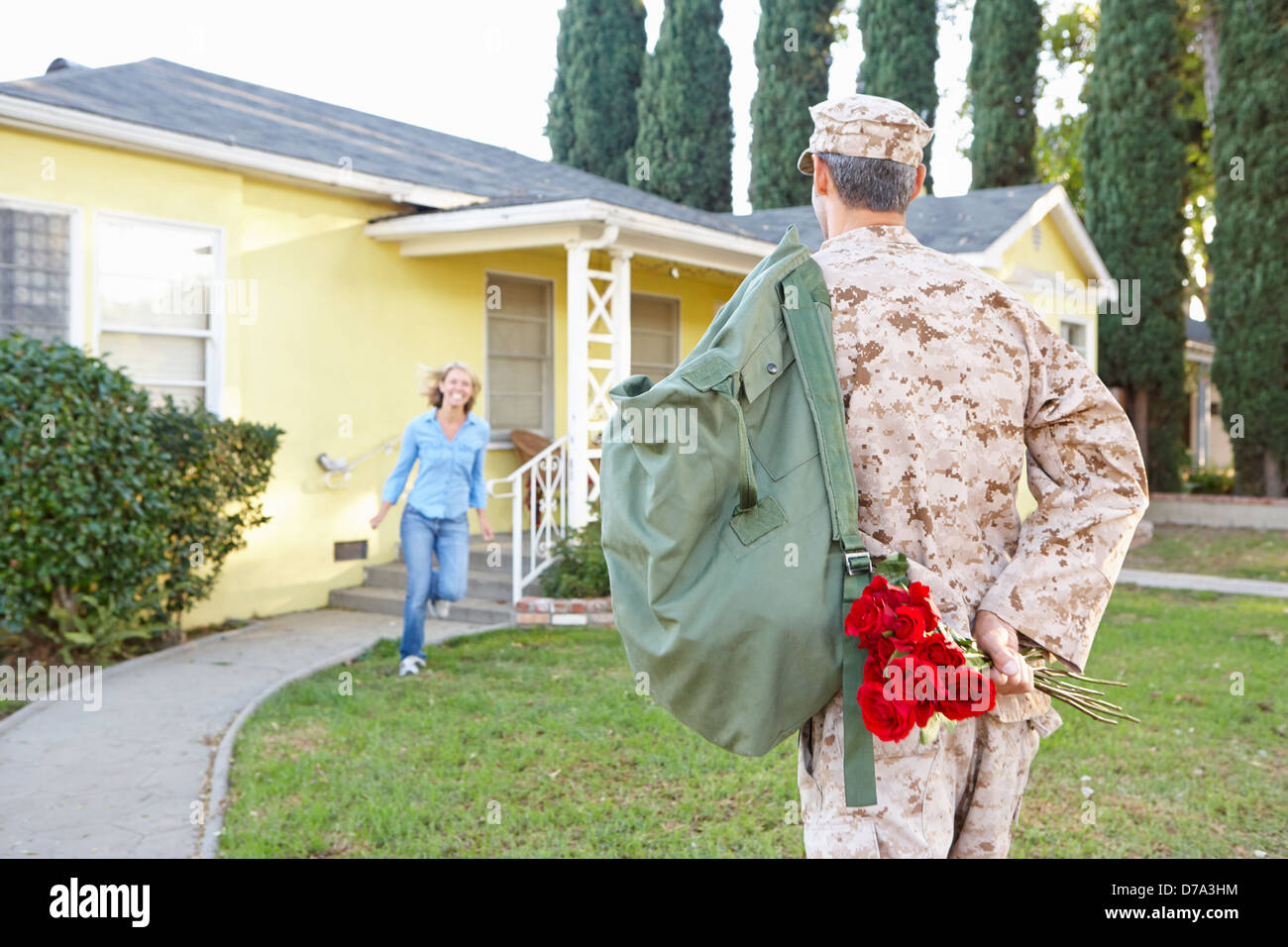 Wife Welcoming Husband Home On Army Leave Stock Photo
