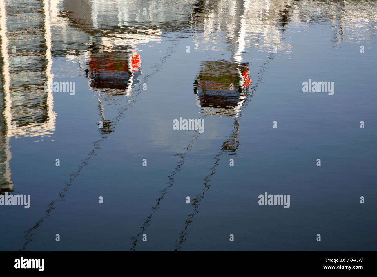 Cable cars from the Emirates Airline reflected in the water of Royal Victoria Dock, Canning Town, London, UK Stock Photo