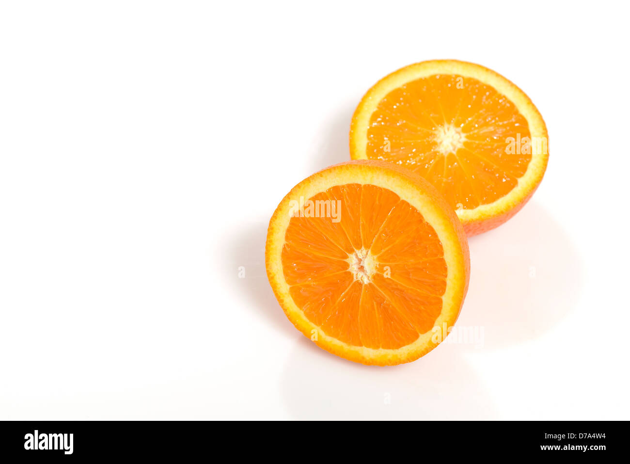 Orange halves over white background Stock Photo