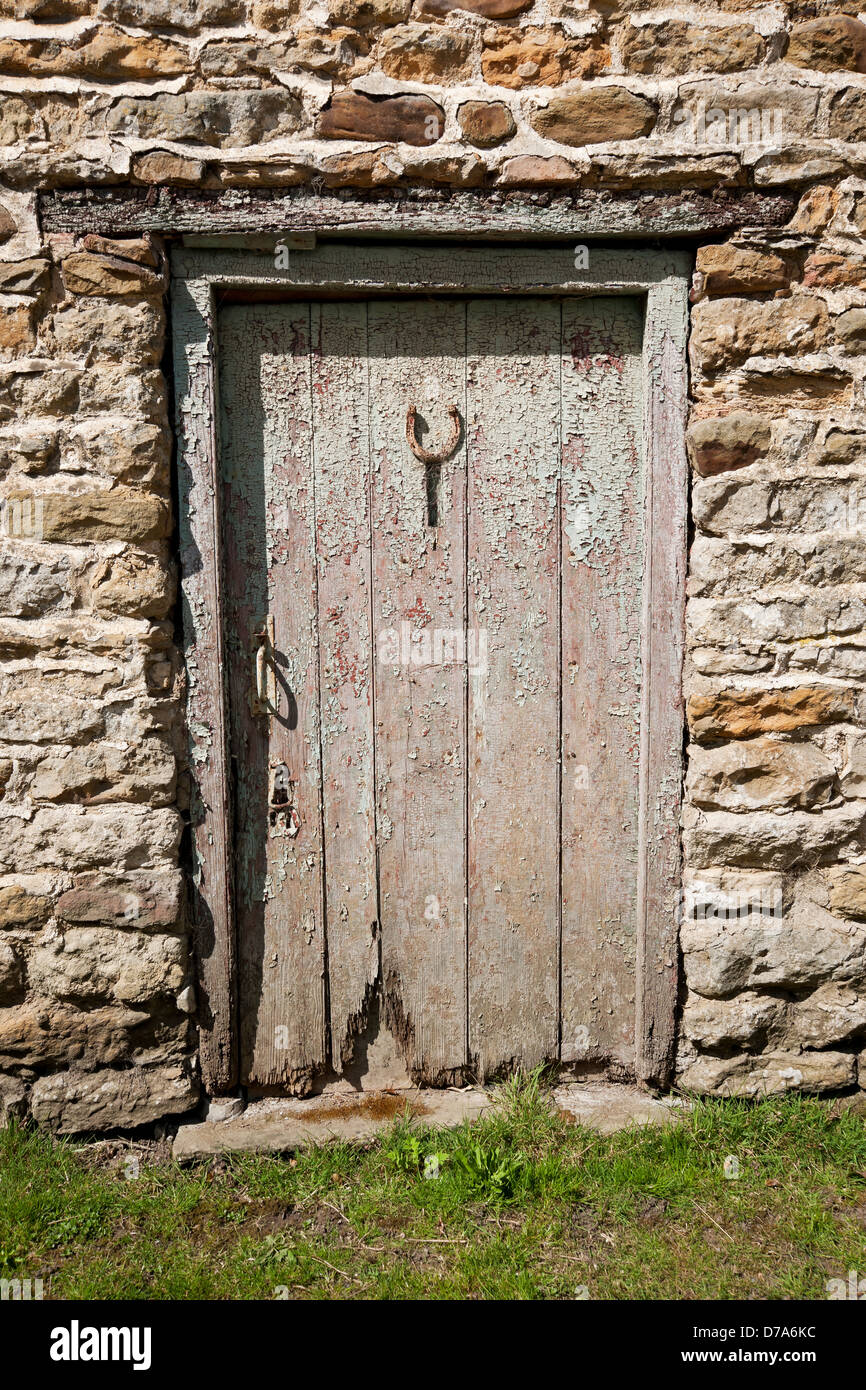 Wooden door detail of stone barn North Yorkshire England UK United