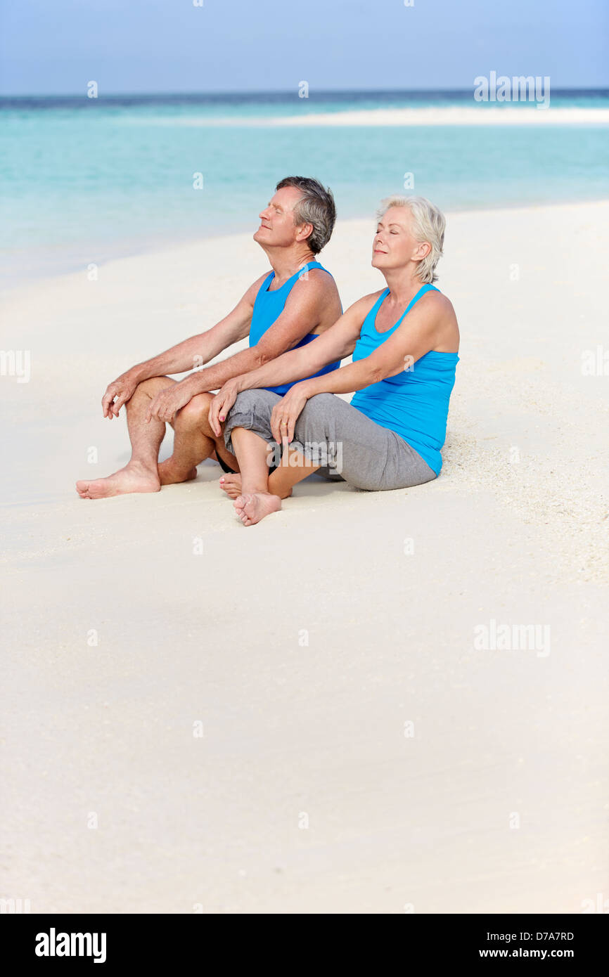 Couple relaxing on beach hi-res stock photography and images - Alamy