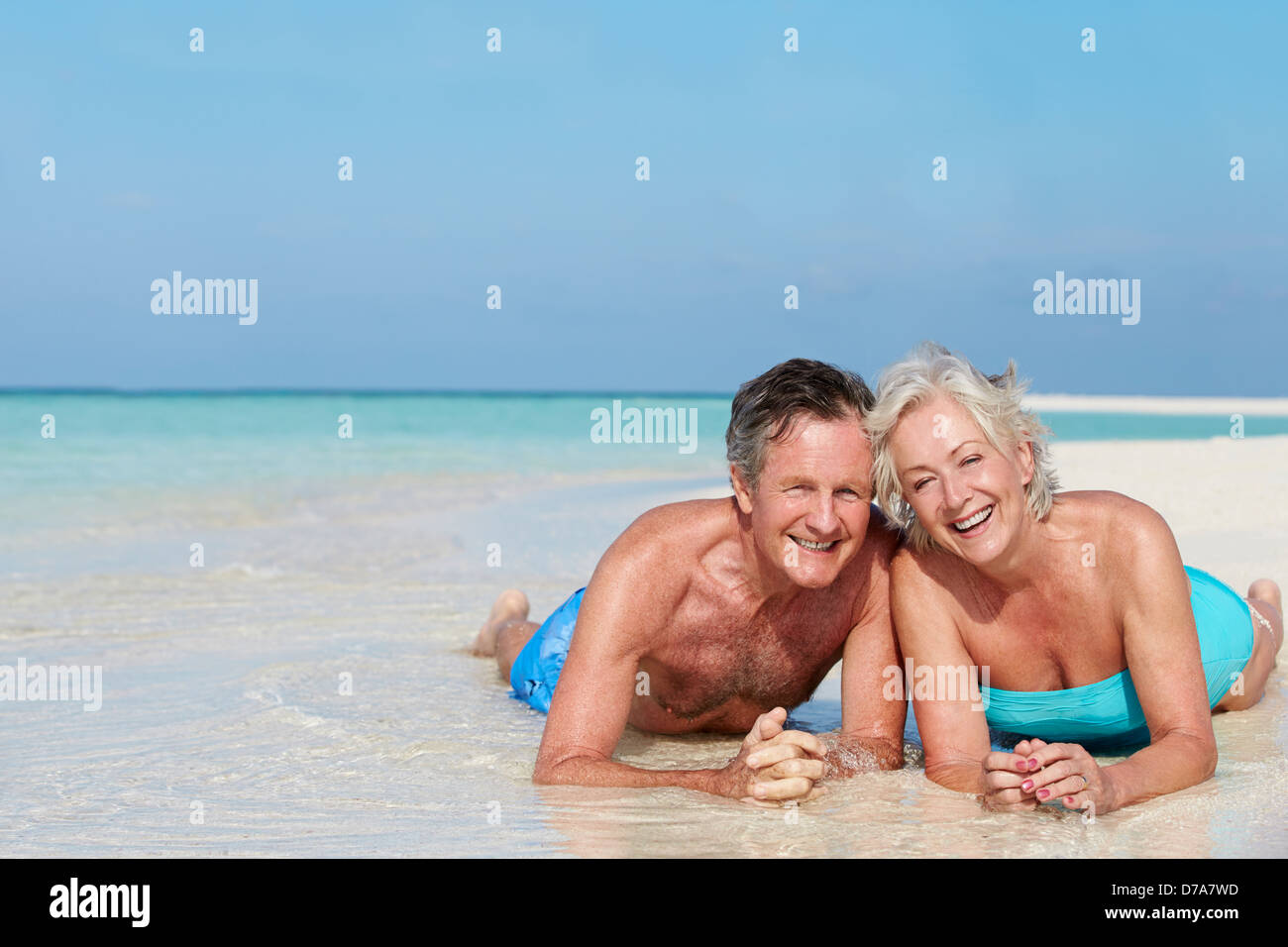 Senior Couple Enjoying Beach Holiday Stock Photo