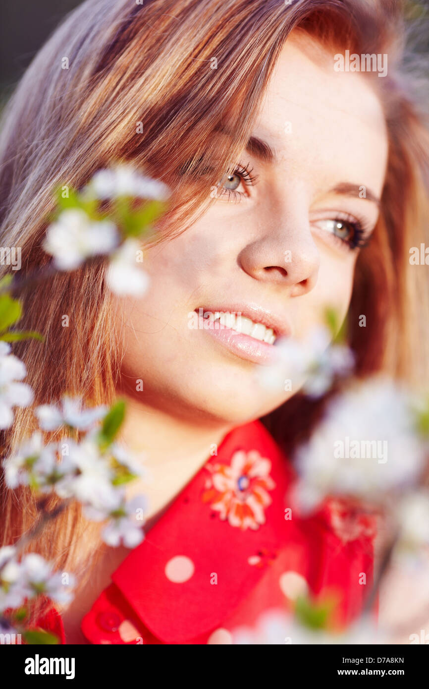 Girl in the flowers of cherry Stock Photo - Alamy