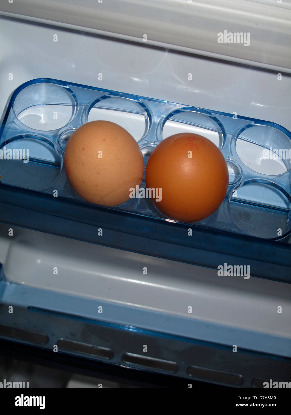 Eggs in refrigerator door rack Stock Photo