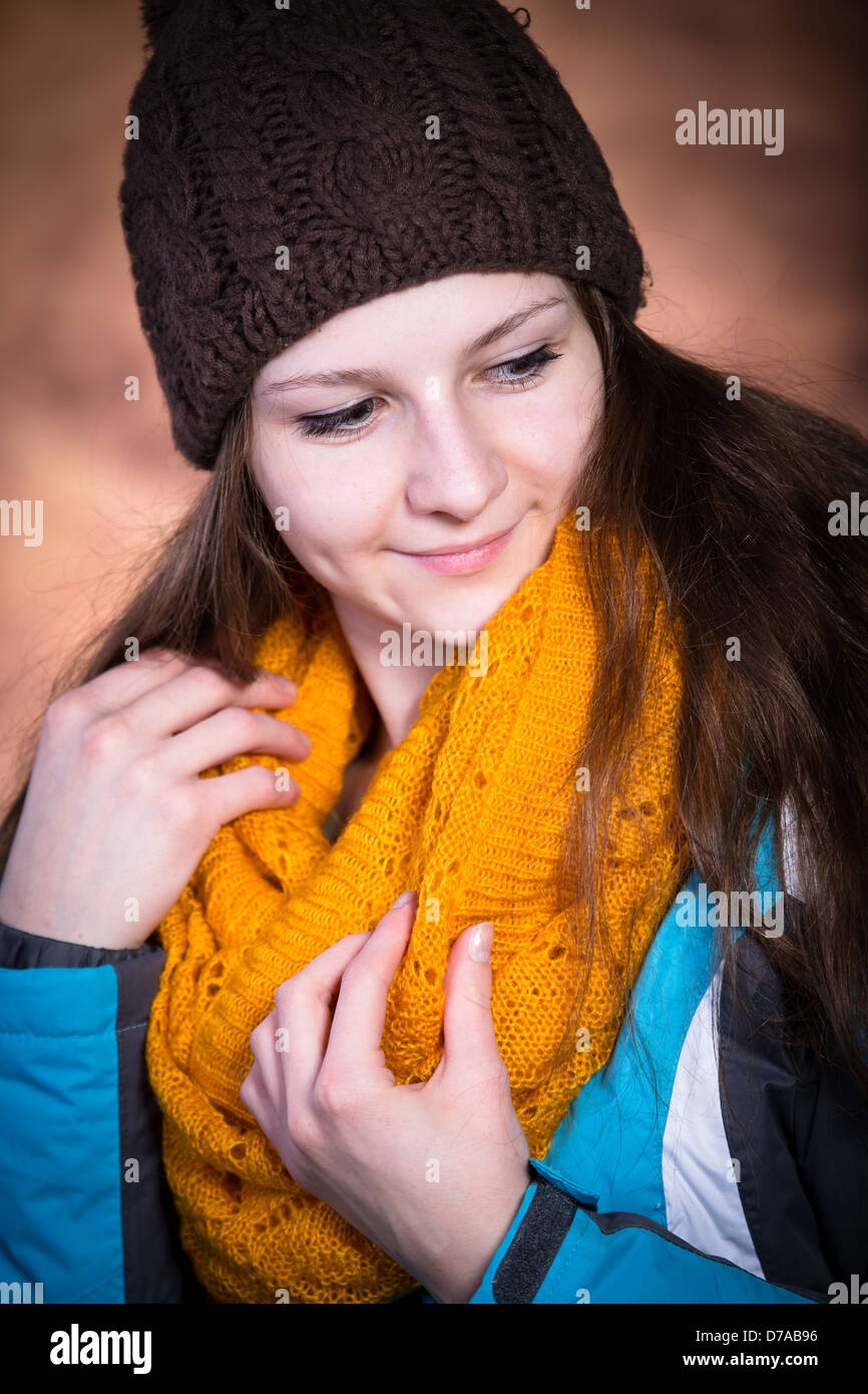 studio portrait of a teenage girl with woollen clothes Stock Photo