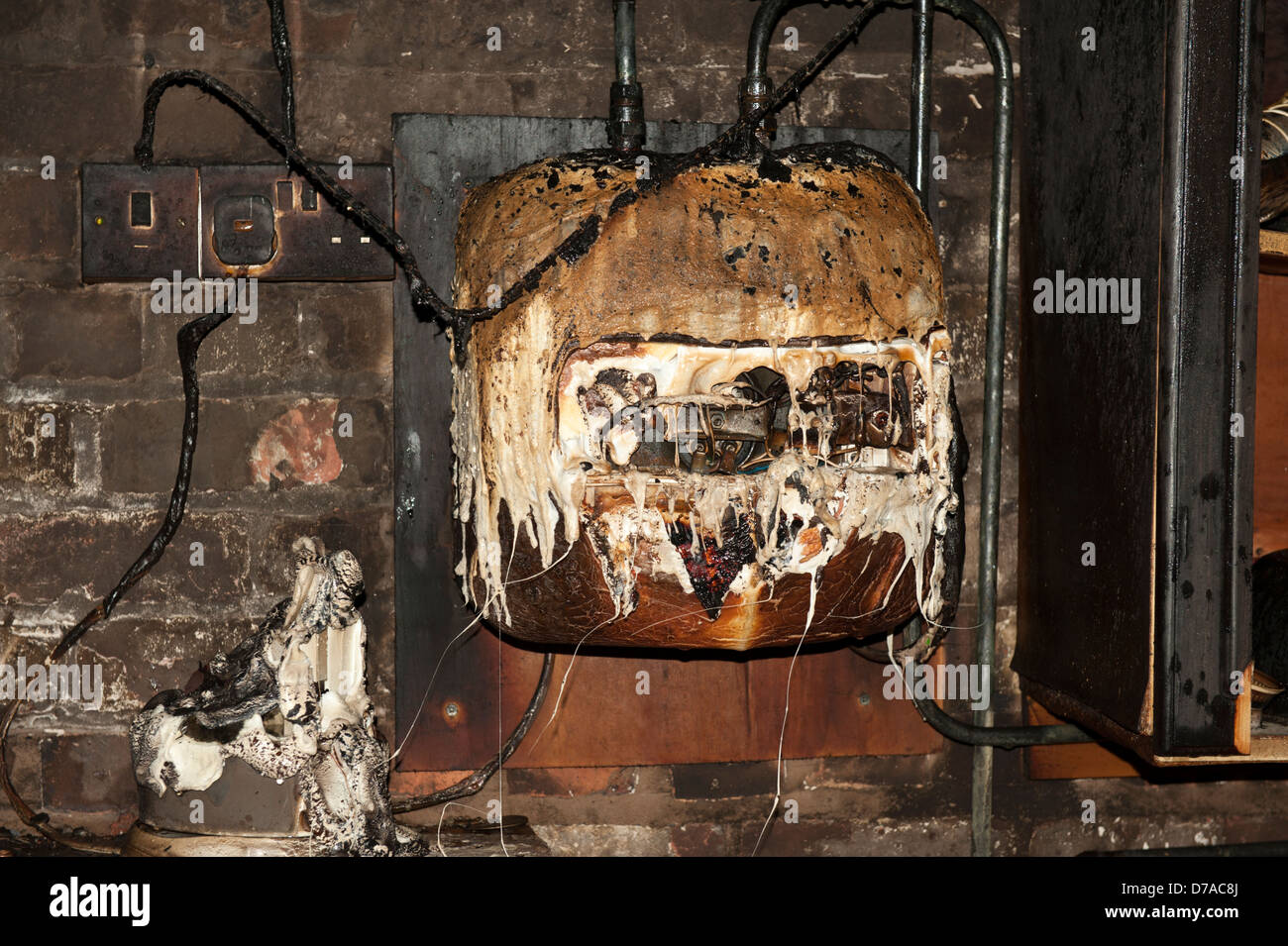 Hot Water Electric Heater fire melted faulty Stock Photo
