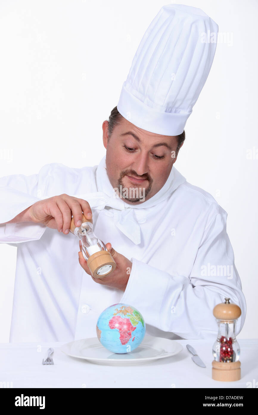 Chef putting salt on his meal Stock Photo Alamy