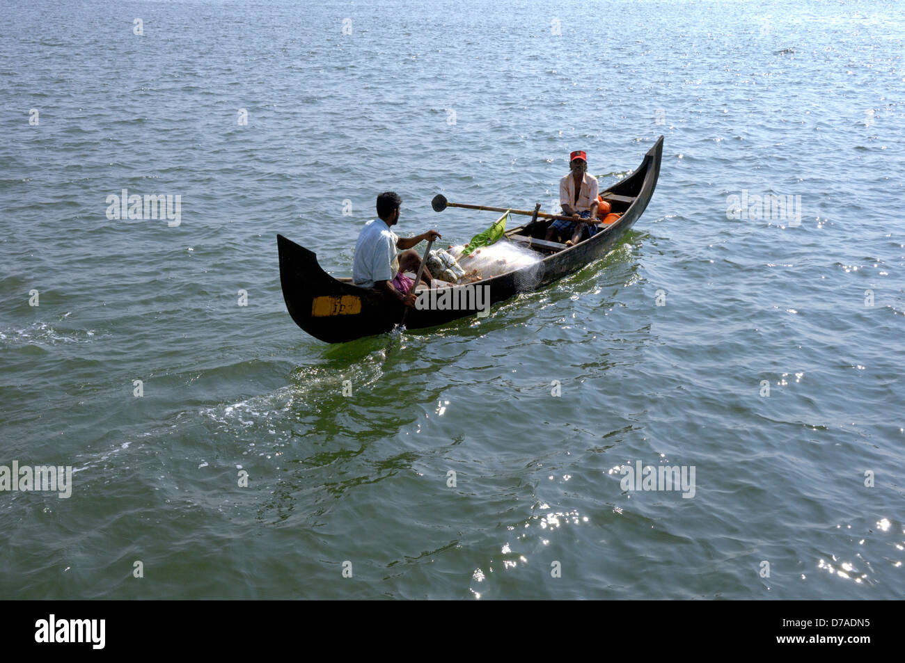Two fisherman going sea paddling hires stock photography and images